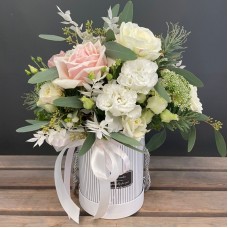 White flowers in a white box (Compact)